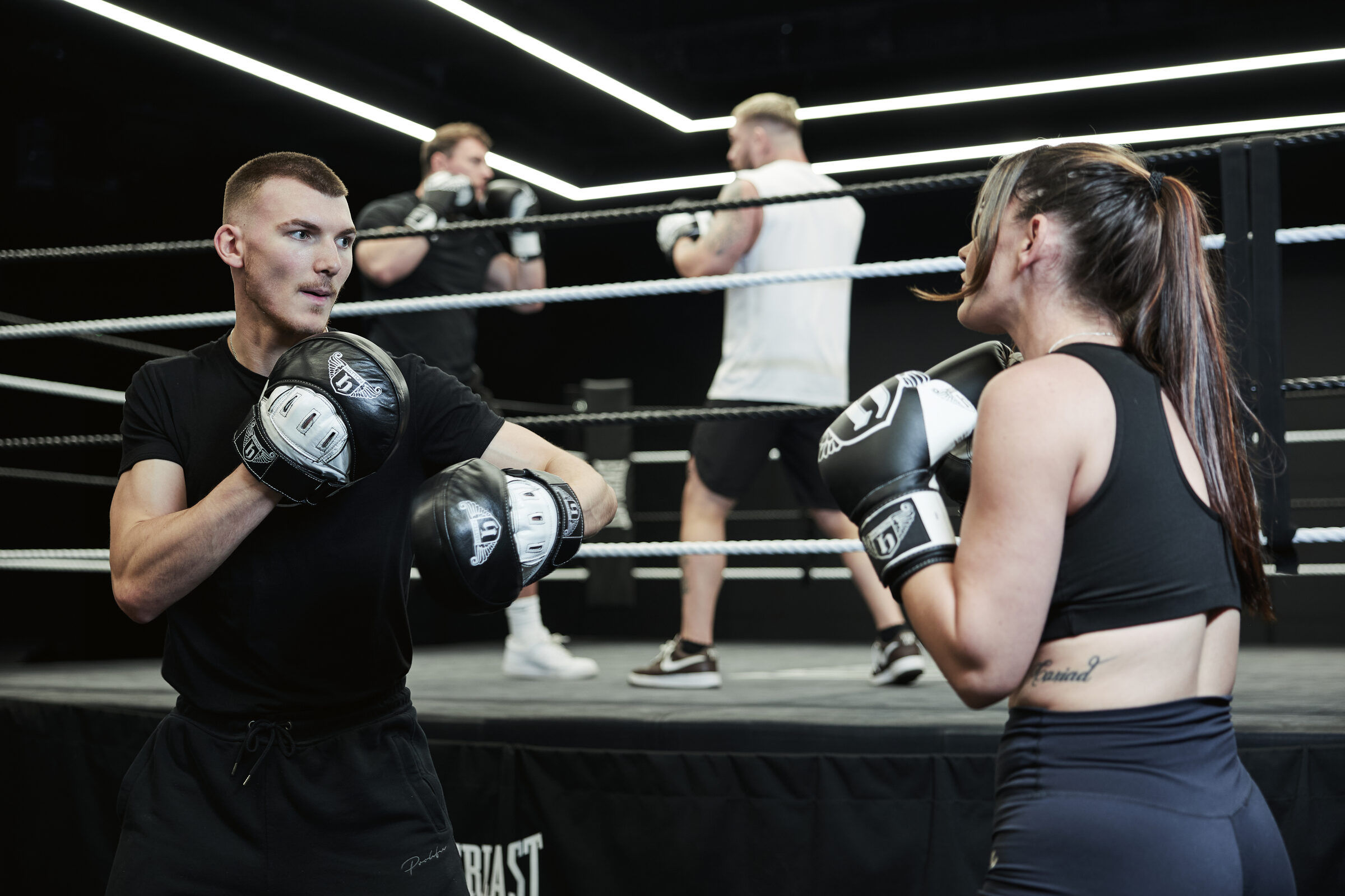 Hatton Boxing instructor holding pads for a client during a session